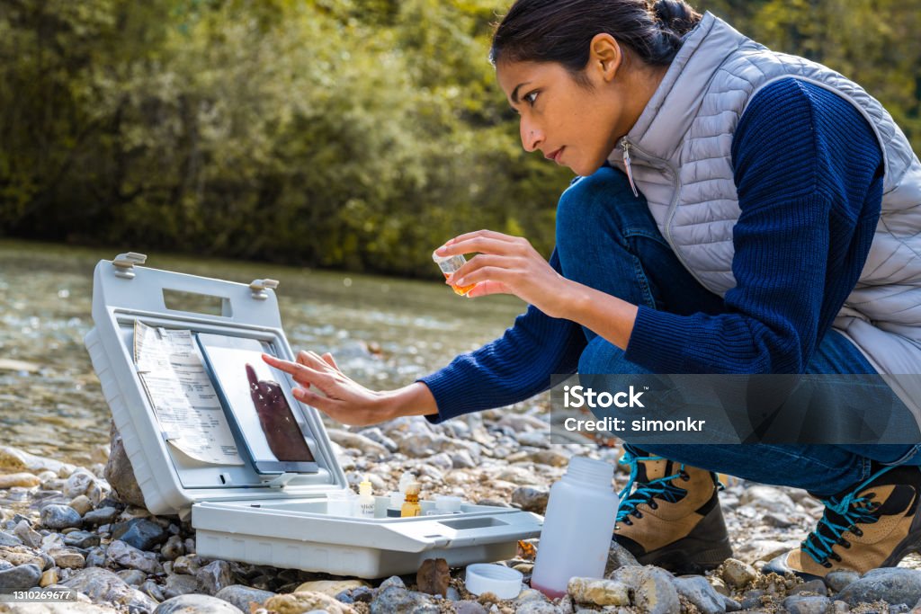 Researcher working outdoors with a tablet (placeholder)