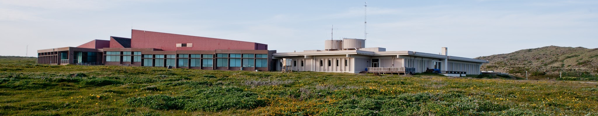 A research facility beneath a wide sky