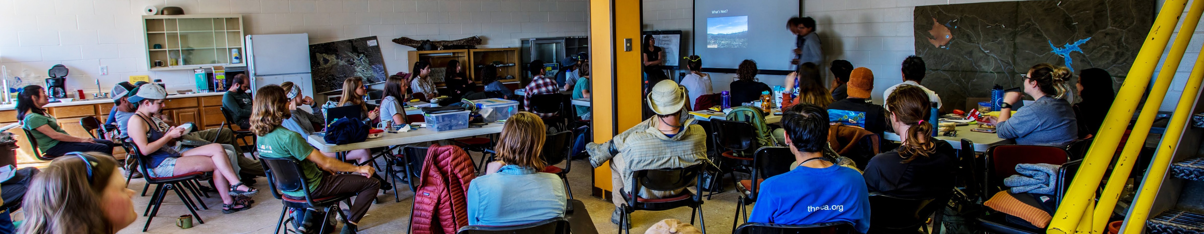 A group workshop in a room with yellow walls